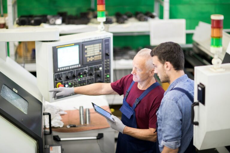 Foreman and worker in factory